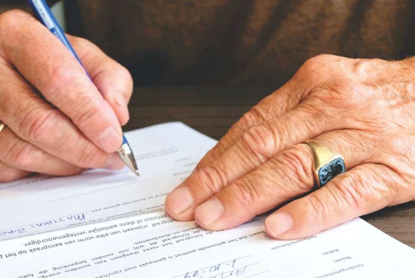 Picture of a doctor's lien getting signed